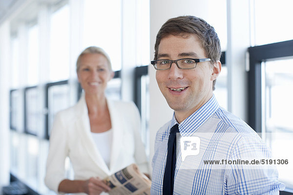 Businessman smiling in office
