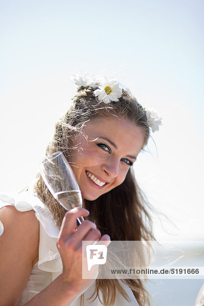 Bride having a glass of champagne