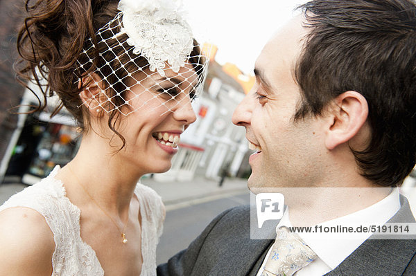 Newlywed couple smiling together