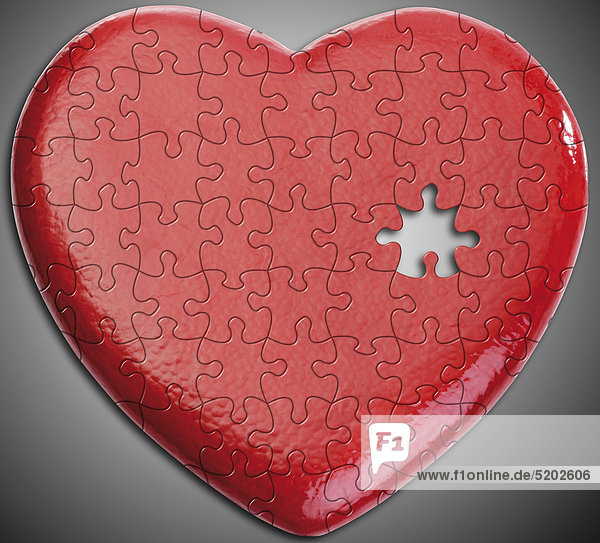 Rotes Herz aus Puzzle-Teilen