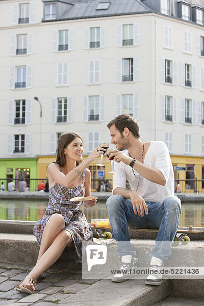 Couple toasting with wineglasses  Paris  Ile-de-France  France