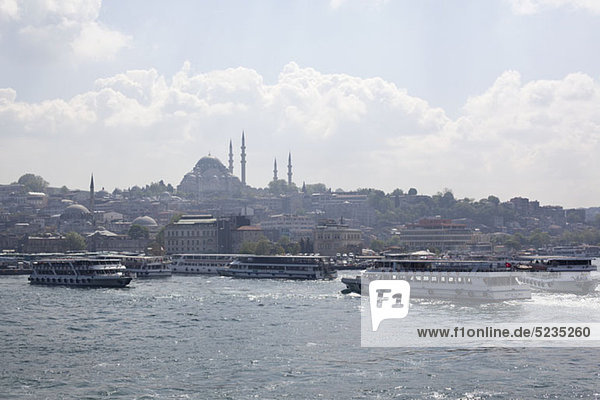 Ferries and tour boats on the Golden Horn River below the Suleymaniye Mosque  Istanbul  Turkey