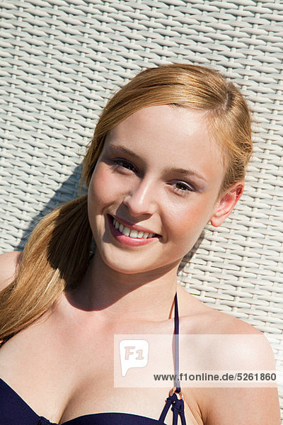 Young woman on sun lounger  portrait