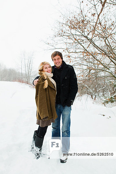 Portrait of mid adult couple in snow