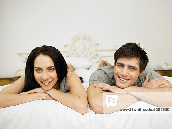 Young couple lying on bed  portrait