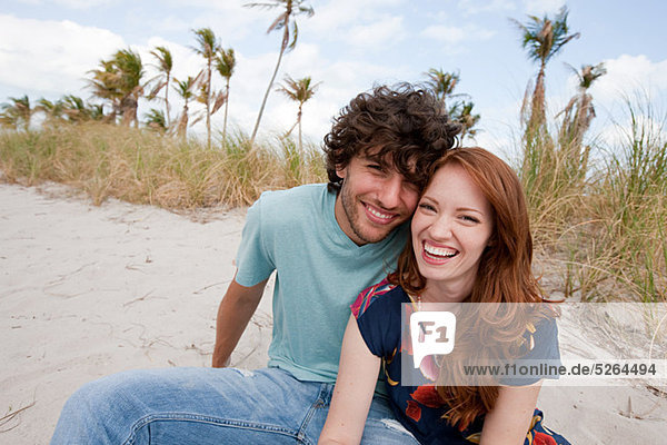 Young couple on beach  portrait