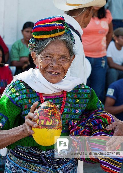 Guatemala  Rabianl  old woman drinking from morro