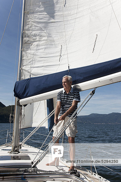 Older man sailing on lake