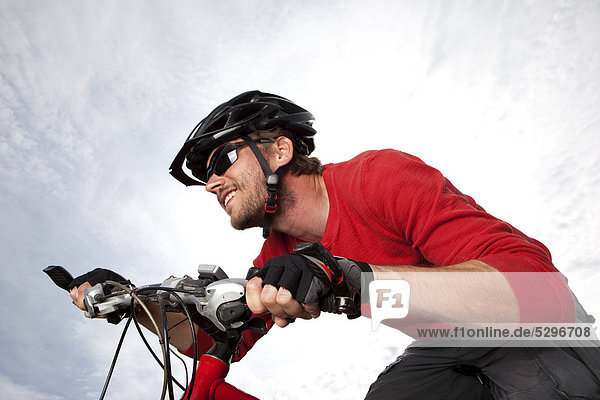 Man in red shirt on mountainbike