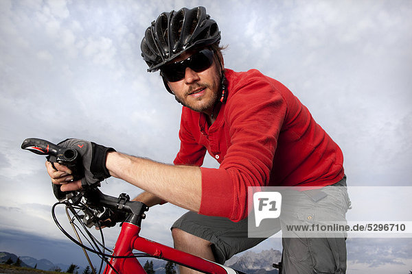 Man in red shirt on mountainbike