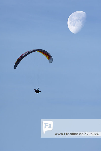 Paraglider with moon  composing