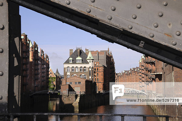 Canal with Wasserschloesschen  bridge in the foreground  Speicherstadt historic warehouse district  Hamburg  Germany  Europe