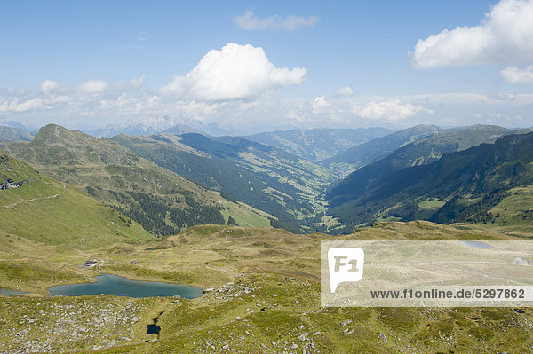 Looking towards Lengau in the valley seen from Gamshag Mountain  2178 m  with Hochtorsee Lake in the foreground  Kitzbuehel Alps  Saalbach-Hinterglemm  Salzburg  Austria  Europe