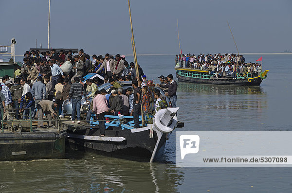 Rustic ferry-boats at Jorhat take more than one hour to cross the mighty Brahmaputra River  India  Asia