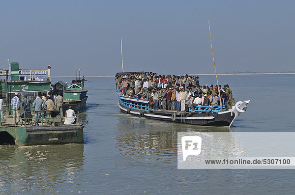 Rustic ferry-boats at Jorhat take more than one hour to cross the mighty Brahmaputra River  India  Asia