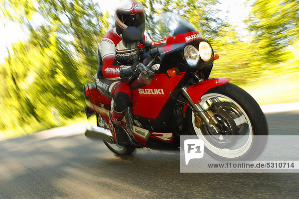 Motorcyclist riding a Suzuki GSX-R 1100