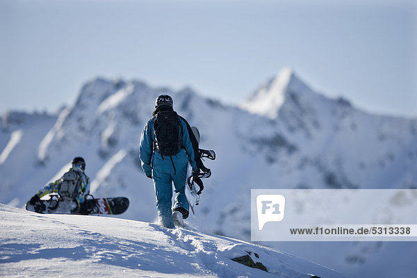 Freeriders  snowboarders walking to the slope  snowy landscape  Alpbach  northern Tyrol  Austria  Europe
