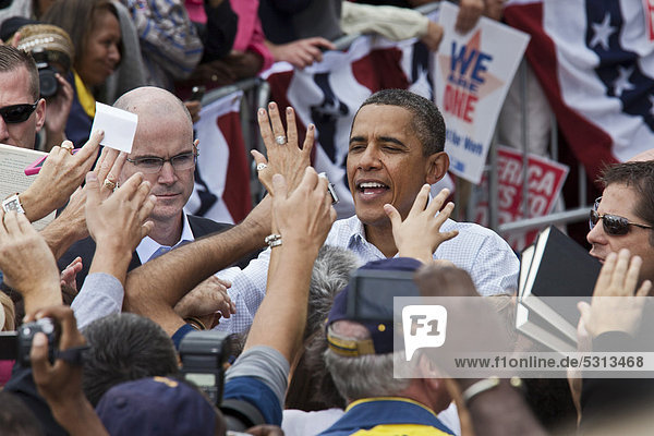 President Barack Obama greets supporters after speaking at a Labor Day rally in Detroit  Michigan  USA