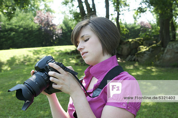 Young woman photographing