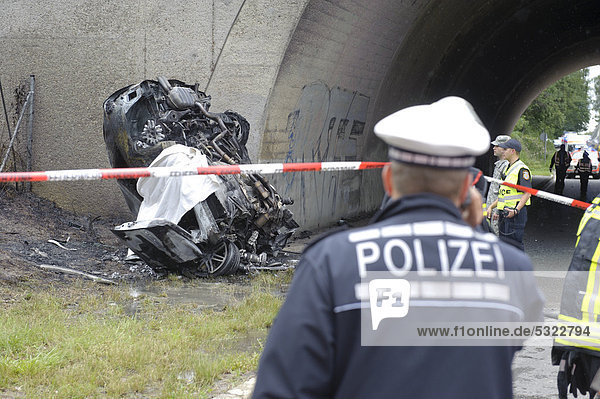 Wreckage of an Audi car destroyed and burned out beyond recognition after a violent collision against the pillar of a bridge Sindelfingen Baden-Wuerttemberg Germany Europe
