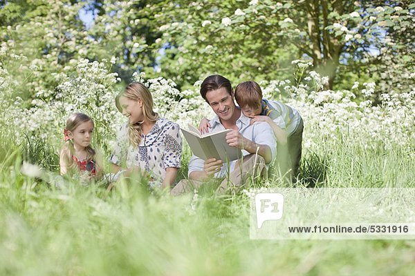 Family relaxing together in grass