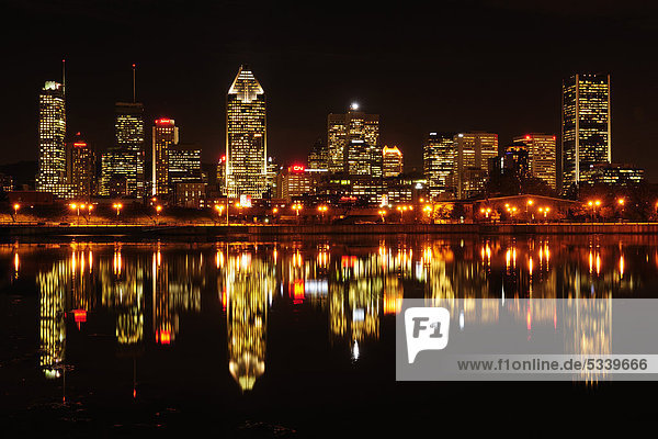 Skyline of Montreal reflected in the St. Lawrence River  Montreal  Quebec  Canada