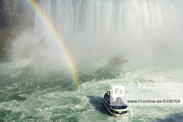 Excursion boat with rainbow directly at the Niagara Falls  Niagara Falls  Ontario  Canada  North America