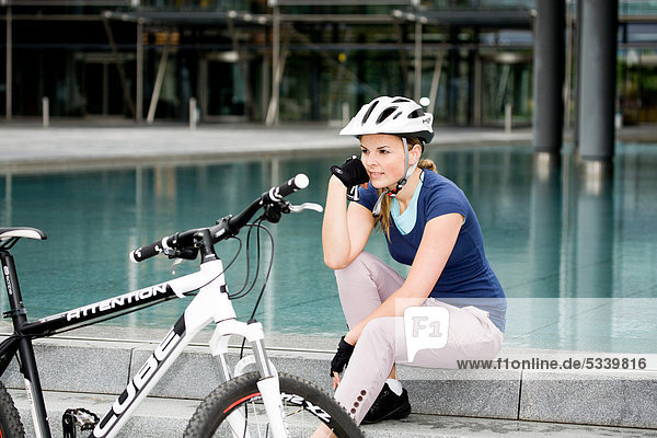 Female cyclist in an urban surrounding