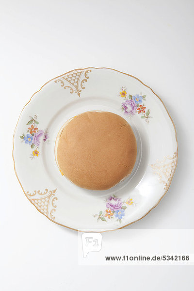 Burger on a plate with floral decorations
