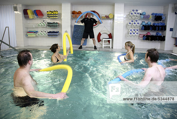 Patients doing aqua aerobics  water aerobics  exercise therapy  physiotherapy in water  e.g. as a rehabilitation program  in a hospital in Germany  Europe