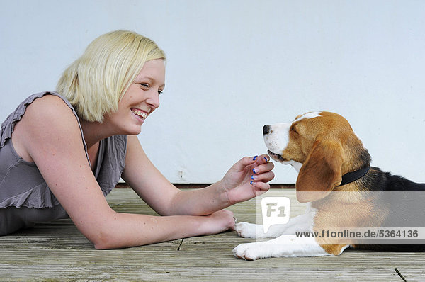 Young woman with her beagle