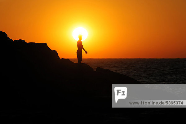 Silhouette of a person at sunset  Las Penitas beach near Poneloya  Leon  Pacific  Nicaragua  Central America