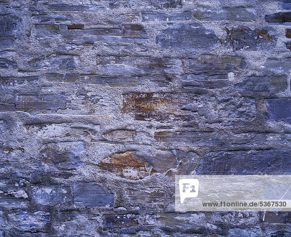 Alte Natursteinmauer  Hintergrund