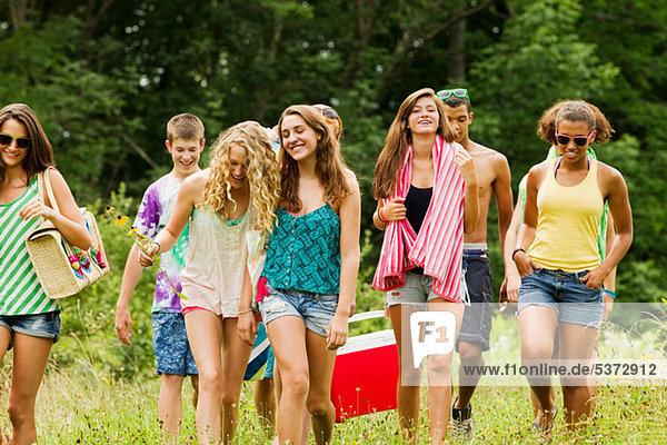 Teenagers going on a picnic together in the countryside