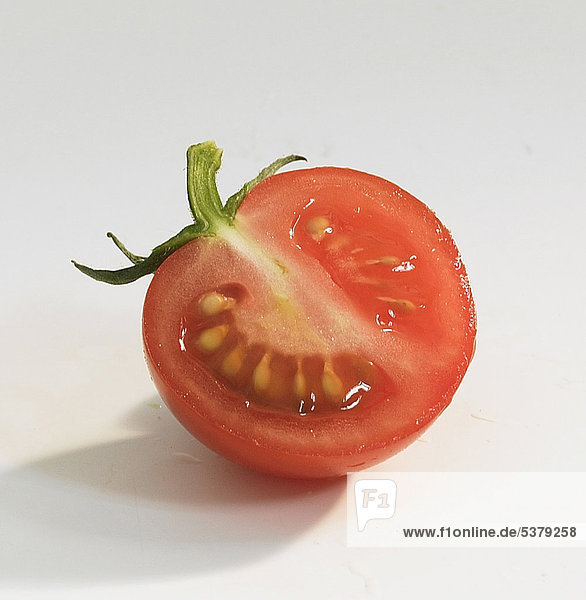 Tomato slice on white background