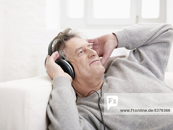 Senior man listening music