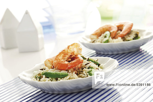 Rice dishes with shrimp  pea pods  long-grain rice and wild rice