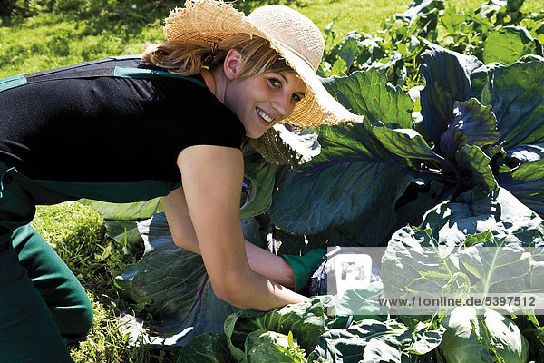 Female gardener in vegetable patch