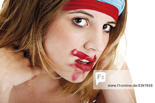 Young woman with colourful headbands and smeared lipstick