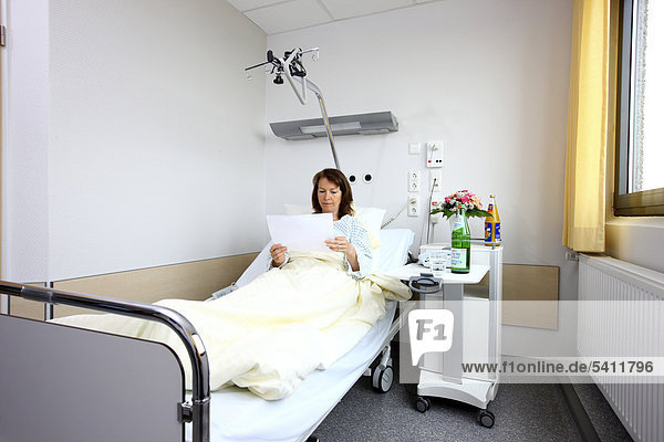 Patient lying in a hospital bed  hospital room  single room  hospital