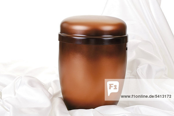 Copper coloured urn