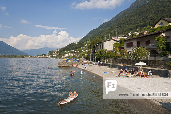 Vira beach  bathers  Gambarogno  Lake Maggiore  Ticino  Switzerland  Europe