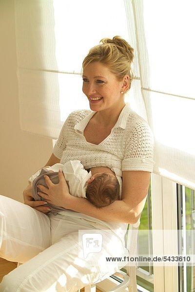 woman - baby breast feeding -