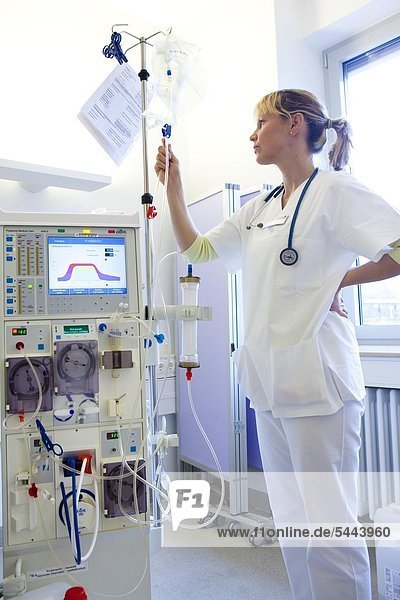 nurse is standing in the dialysis ward