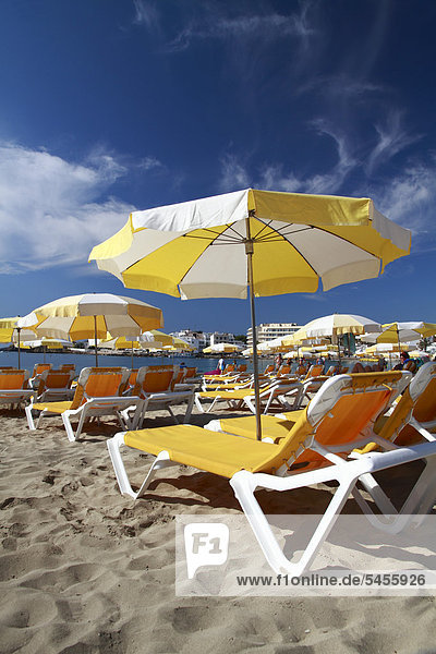 Sunbeds and sunshades on the beach of Es Canar  Ibiza  Balearic Islands  Spain  Europe