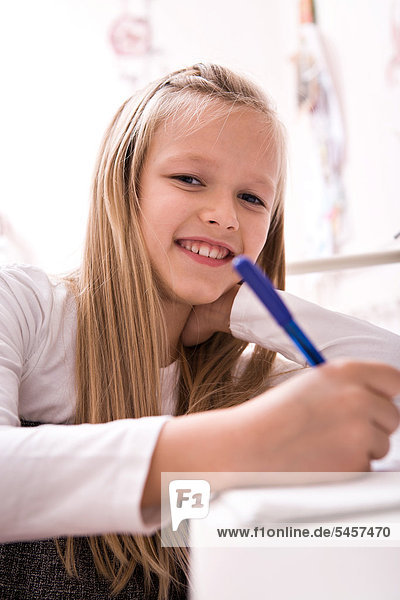 Girl  9  seated at her desk
