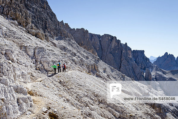 Hikers in the Alpinisteig route  Dolomites  Hochpustertal Valley  Sexten  Dolomites  South Tyrol  Italy  Europe