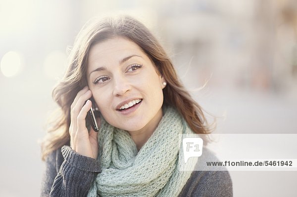 Young woman talking on cell phone