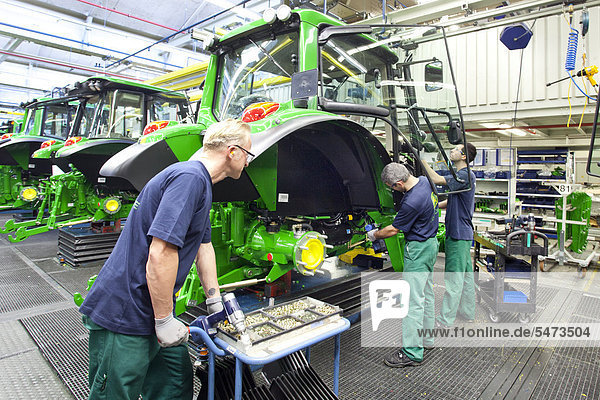 Assembly of doors in the tractor production section at the European headquarters of the American agricultural machinery manufacturer John Deere  Deere & Company  Mannheim  Baden-Wuerttemberg  Germany  Europe