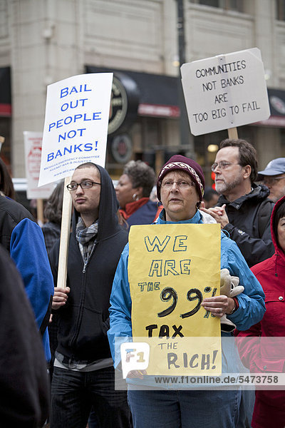 Protesters  including members of the United Auto Workers and activists from the Occupy Detroit encampment  rally at the Bank of America  demanding a moratorium on home foreclosures and evictions  Detroit  Michigan  USA